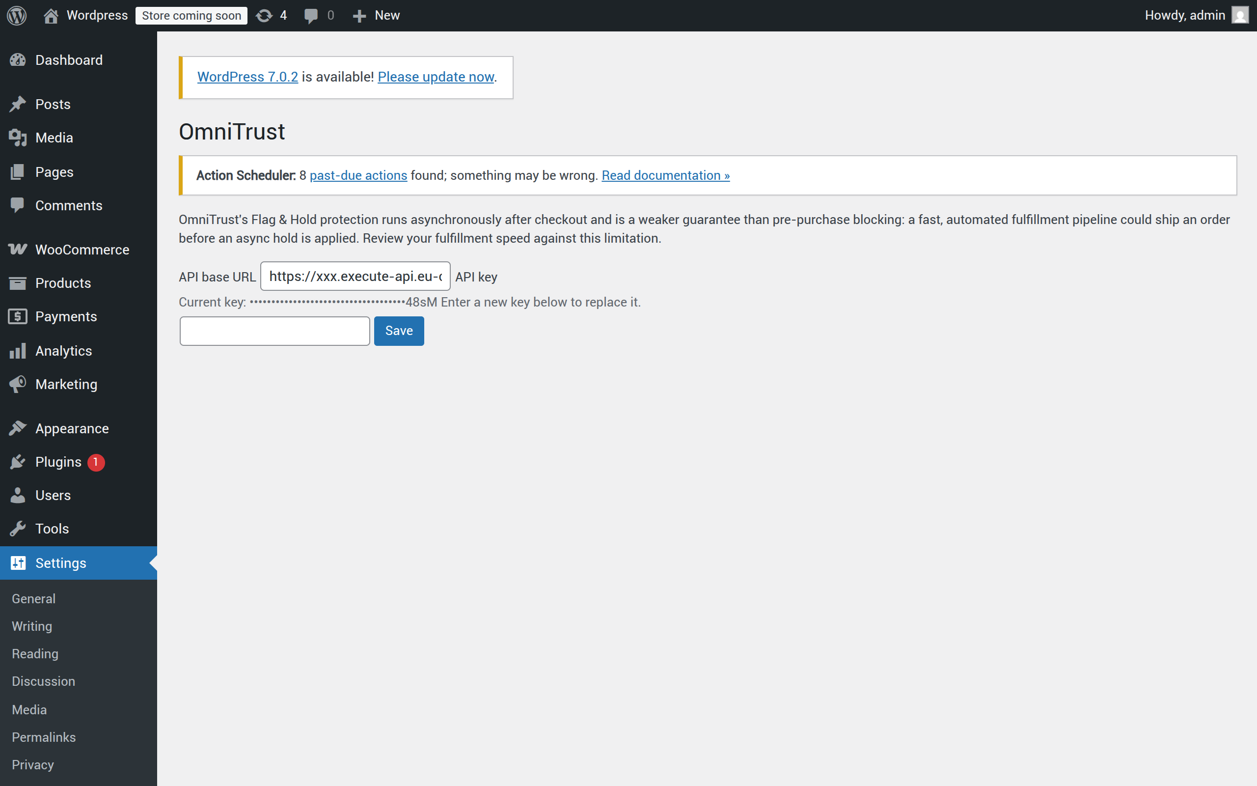 OmniTrust for WooCommerce Settings page with masked API key and fulfillment-race notice